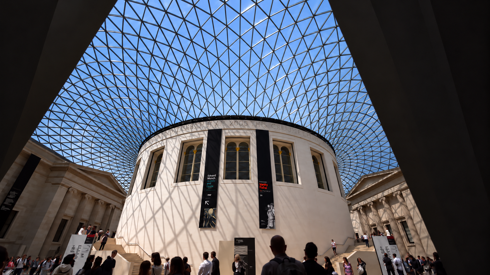 Front view of the British Museum Great Court, with the round Reading Room, glass roof and visitors