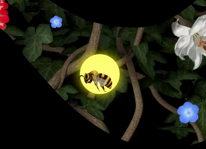 A bee inside a glowing placement point, surrounded by projected flowers.